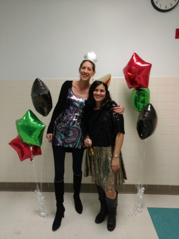 Spanish teachers Andrea Veltman and Yamalie Colon show their school spirit in sparkly attire.