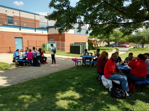Students enjoy the cookout outside near the senior lounge. 
