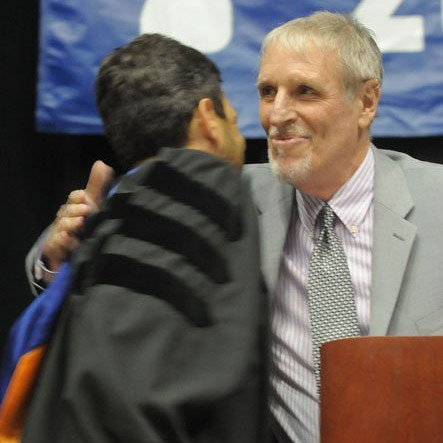 Paul Russell congratulated by former student Delegate Scott Surovell  after his retirement speech at West Potomacs 2013 commencement. 