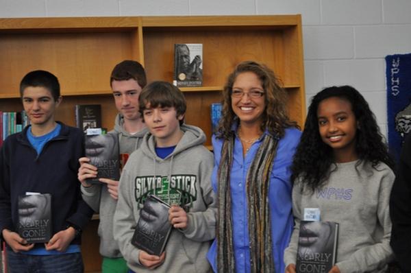 Author Elle Cosimano with several WPHS students who won raffled copies of her novel. 