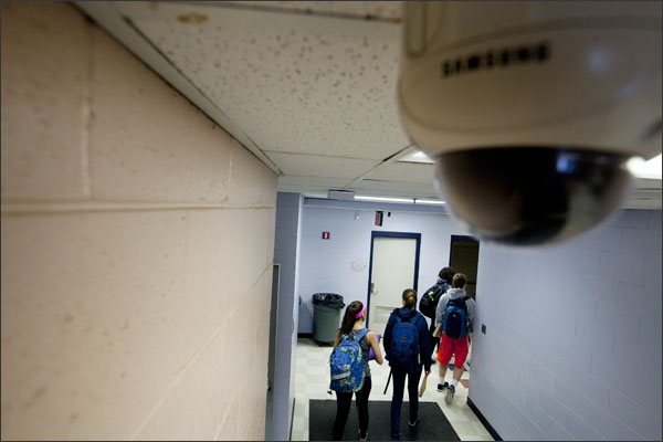 A surveillance camera watches over students heading to their next class at Walpole High School in Walpole, Mass. Courtesy of EducationWeek.org
