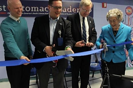 Mr. Case gets ready to cut the ribbon on the Clifford S. Hardison Governor's Health Sciences Academy 