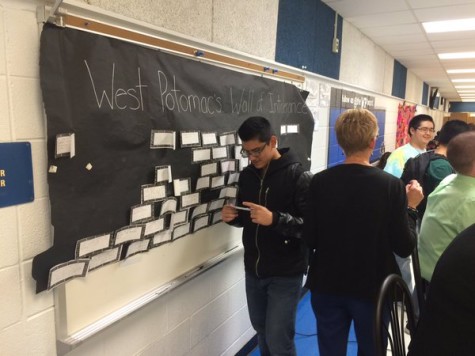 Students tear down bricks with different situations of intolerance written on them. The goal was to bring the whole wall down.