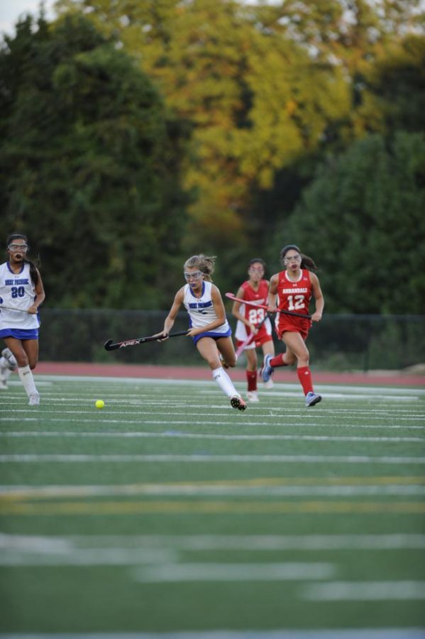 Freshman Isabella Irwin races with ball in game against Annandale.