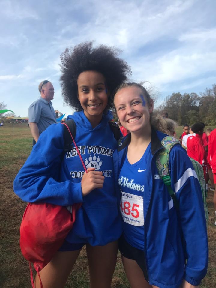 Bowman Shaughnessy (right) and Aminata Johnson (left) smiling big after Cross Country Regionals. Picture taken by Ellie Messina.