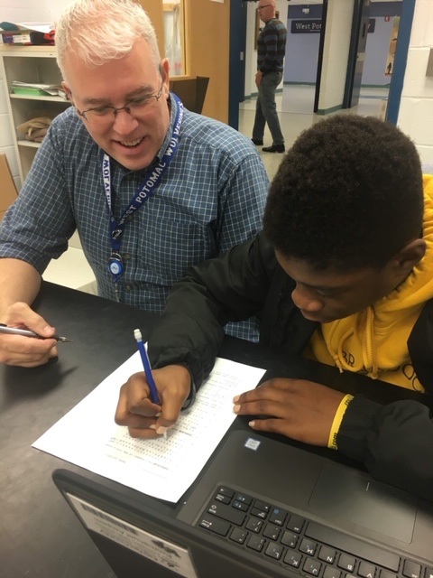 Pictured is Mr. Chapman helping a student. 