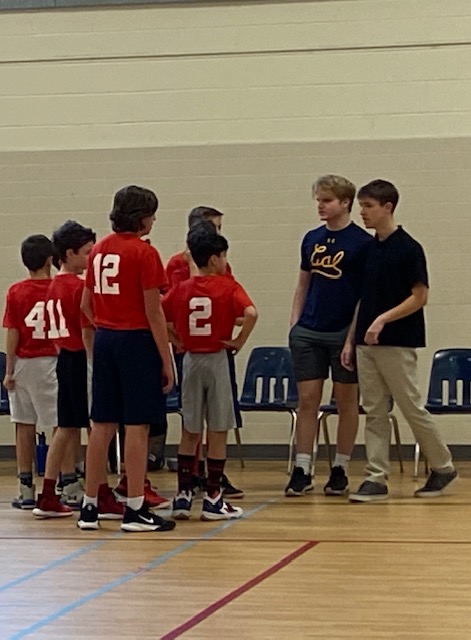 Juniors Jake Cooper and Sean Curtin in team huddle during game. 