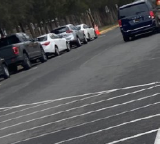 A car drives off campus for lunch.
Photo Credit: TaMon Hendricks