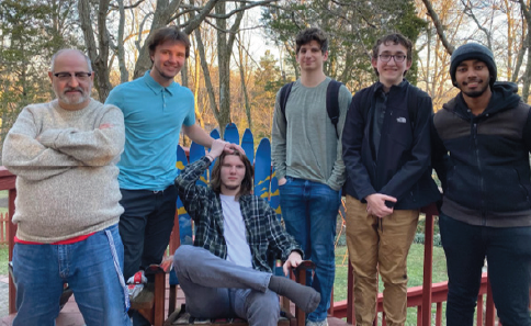 The Ethics Bowl semi-finalists with their coach. Photo Credit: Michael Carlson