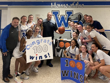 Girls basketball team celebrates with coach Colligan  Photo: Team Parent 