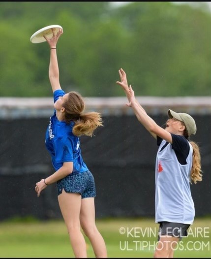 Lorelei Dean, a senior captain, strikes down an airborn frisbee.
Photo: Kevin LeClaire