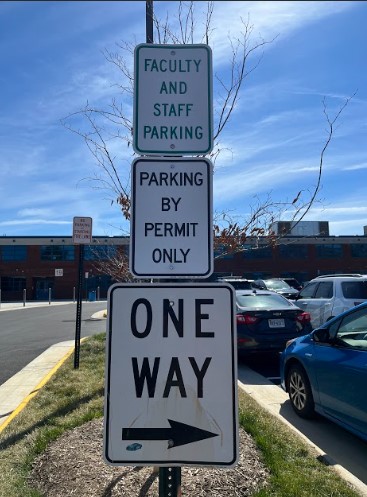 A sign discouraging students against parking lot misdeeds in West Potomac's lot, located behind the Gunston building.