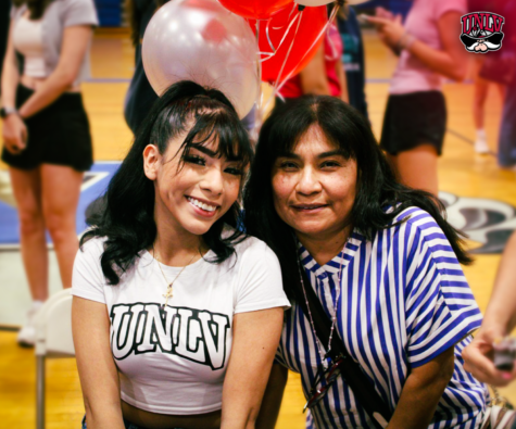 Allison Balladares, senior, poses with her mother following West Potomac’s “Next Level” Signing Ceremony. Photography by Peter Rainey.