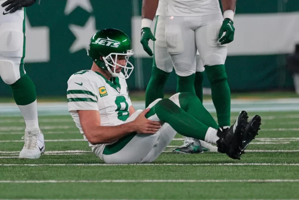 New York Jets star quarterback Aaron Rodgers down on the field in week 1 right after he tore his Achilles.