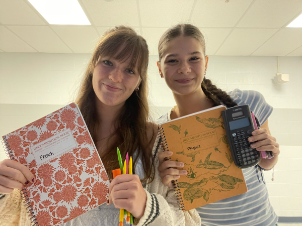 Claudia Bunea and Lucy Wilson posing with some of their Back To School supplies