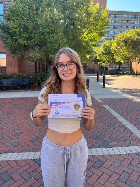 Piper Qutub, Class of 2023, shows off her absentee ballot before
she drops it in the mail at VCU. There is a student holiday in
FCPS on election day: November 5.