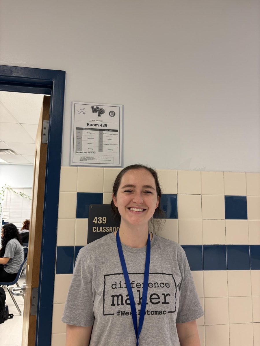 Mrs Herman, a teacher who studied at the University of Virginia standing outside her math class.