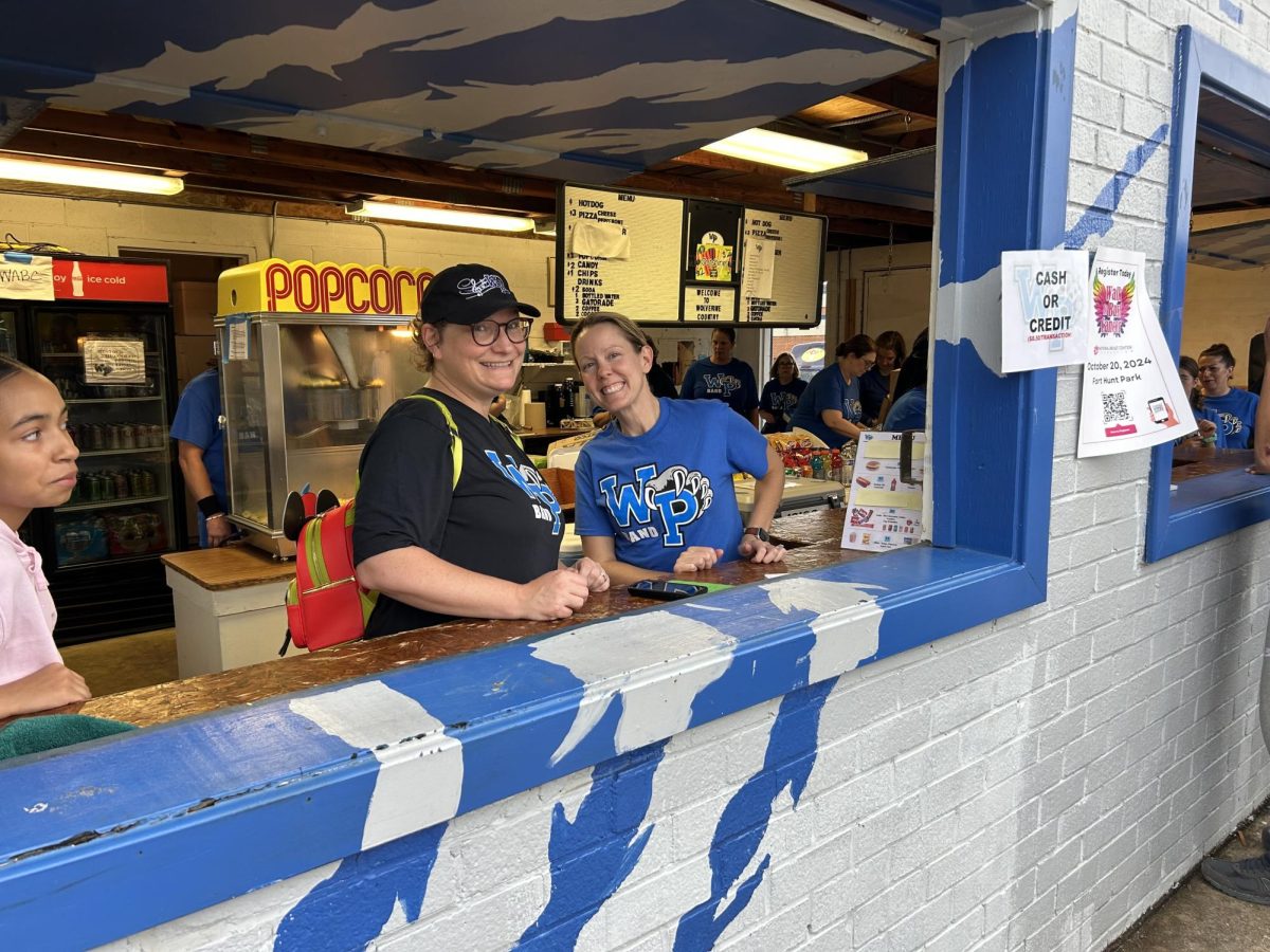 Parent volunteers help to raise funds for the West Potomac Athletics groups by selling food at every home football game.