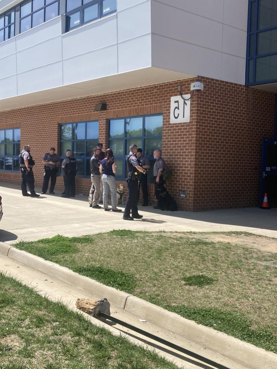 Police officers stationed around the building. 