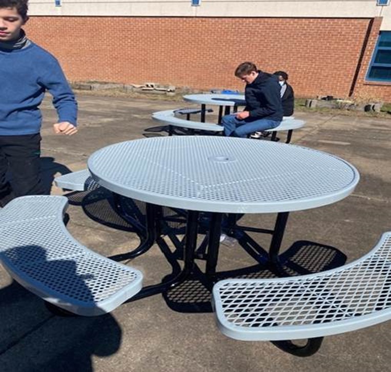 An $1,800 grant from “Educate Fairfax” allowed students from the Pulley Center to help build new tables for the courtyard.             