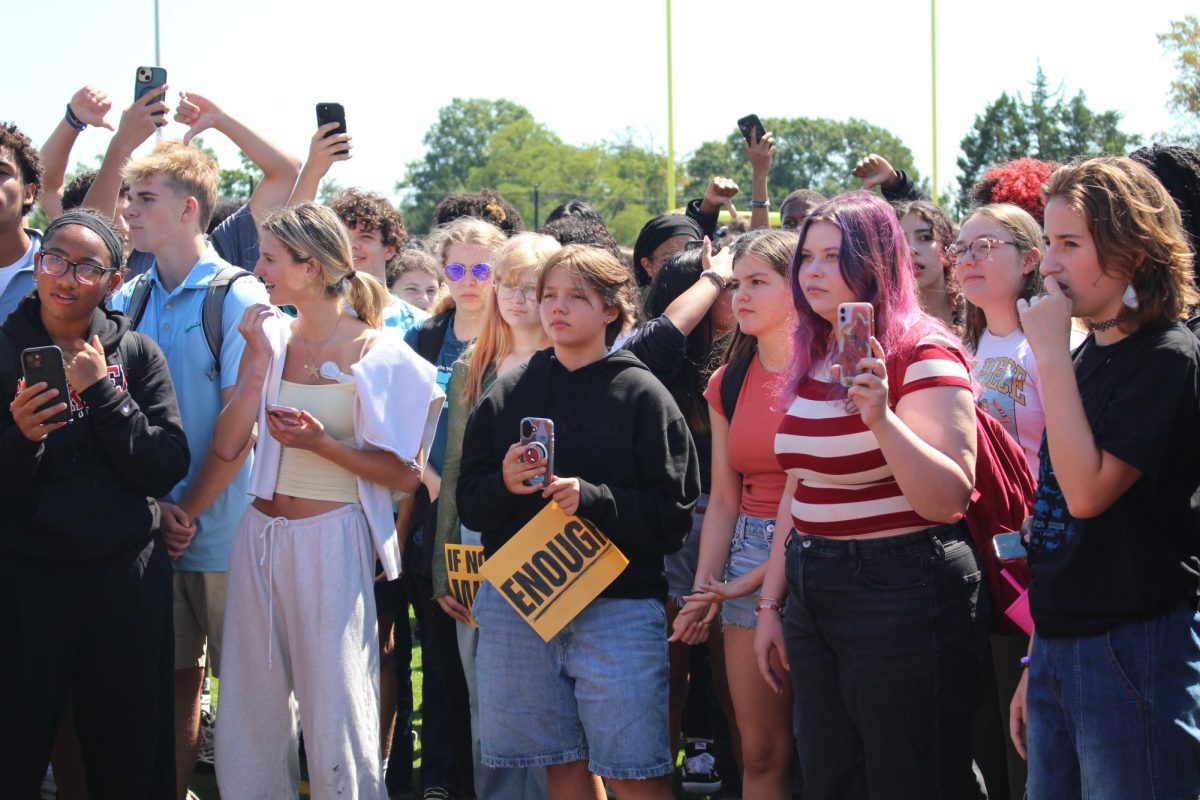 Students record the speakers at a Sep. 5th walkout against gun violence. Students who attended the walkout did not receive any disciplinary consequences despite the new FCPS walkout policy. 