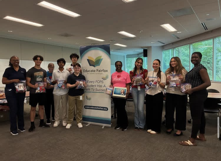 Abby Leach and other interns with the packaged snacks they made for Title 1 schools.