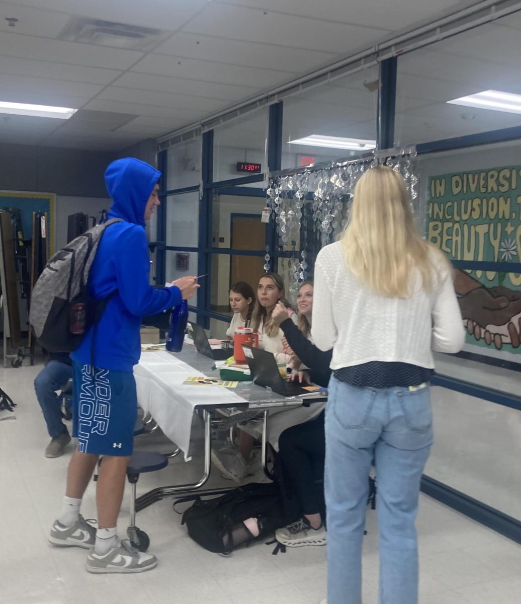 West Po student buys Homecoming ticket.
