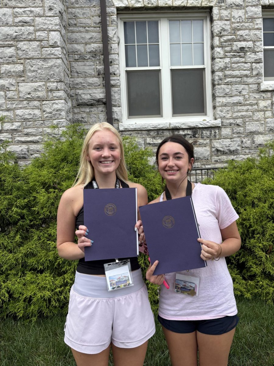 West Po Wire staff members, Leila Freimanis and Emma Fetterolf with the awards they won at JMU journalism camp this past summer.