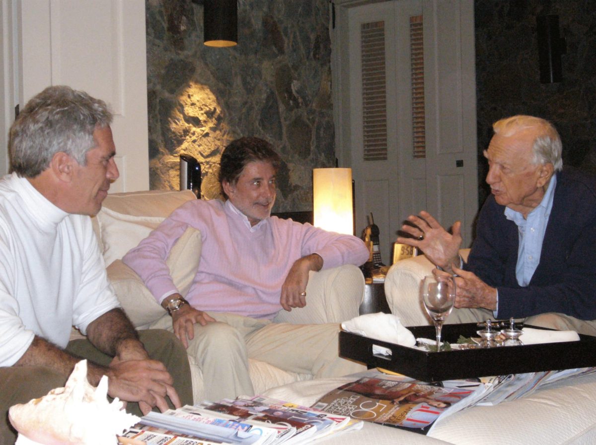 Former CBS news anchor Walter Cronkite speaks with late financier and convicted sex offender Jeffrey Epstein in an undated photograph released by the Department of Justice in Washington, D.C., U.S., on December 19, 2025 as part of a new trove of documents from its investigations into Epstein. U.S. Justice Department/Handout via REUTERS