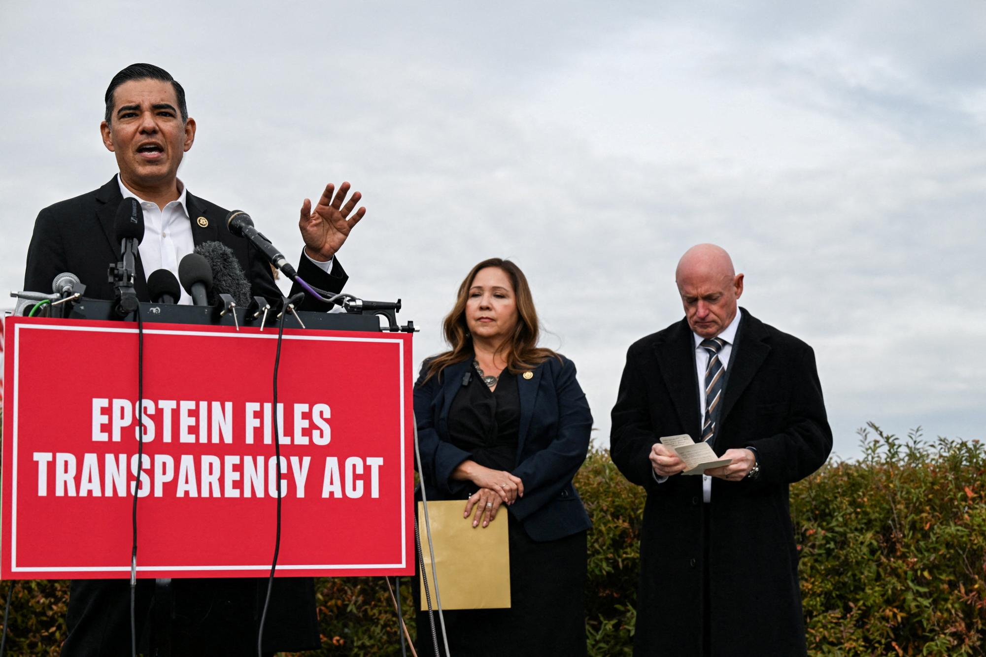 U.S. Representative Robert Garcia (D-CA) speaks next to U.S. Senator Mark Kelly (D-AZ) and U.S. Representative Adelita Grijalva (D-AZ) at a press conference calling for the release of the Epstein files, on Capitol Hill in Washington, D.C., U.S., November 18, 2025. REUTERS/Annabelle Gordon