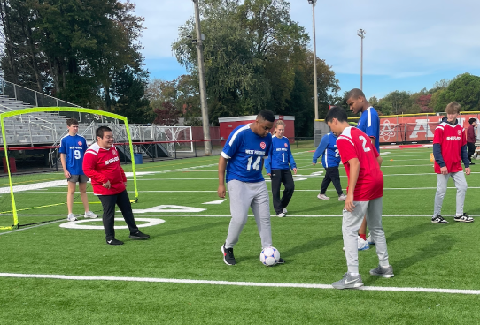 Unified members participating in a soccer game.