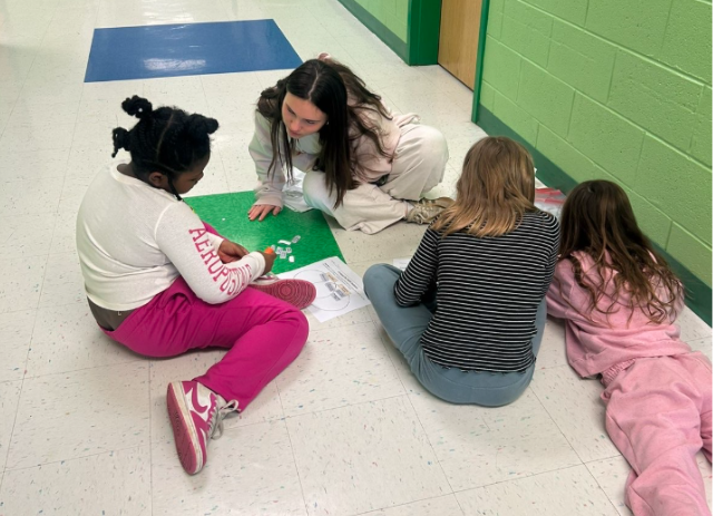 West Po student tutors Elementary schools students at Stratford Landing Elementary school.